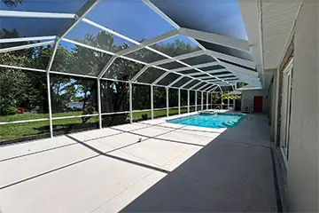 Large white pool enclosure by East Coast Aluminum